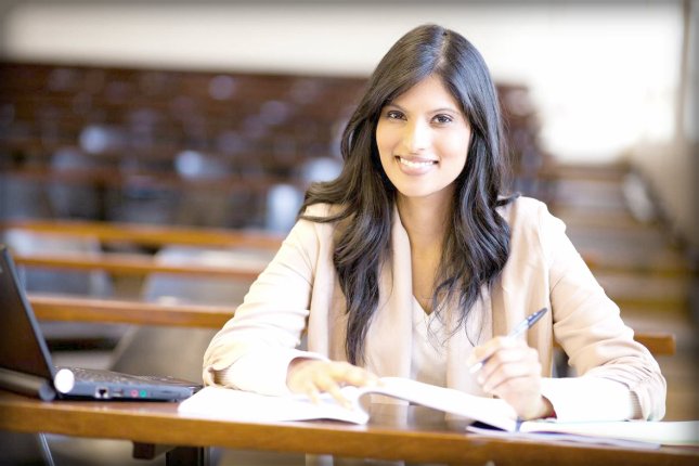 beautiful female indian college girl in lecture hall
